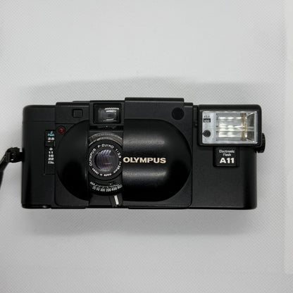Olympus XA, clamshell open showing F.Zuiko lens