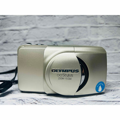 Olympus ∞ Stylus 115 DLX - Filem.sg
