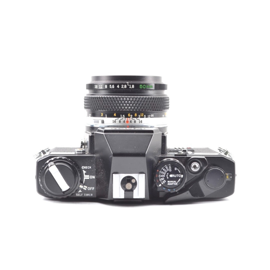 Olympus OM-10 with Zuiko MC 50mm f/1.8 - Filem.sg